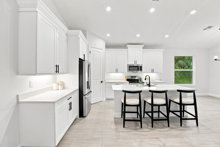 Kitchen with island and bar seating at 4570 Oakley Road, North Port