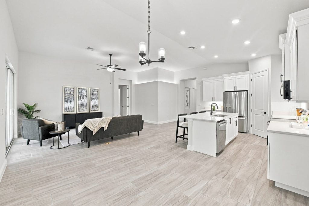Open kitchen and living area inside 4570 Oakley Road, a Foxtail home built by Eastern Homes in North Port, Florida