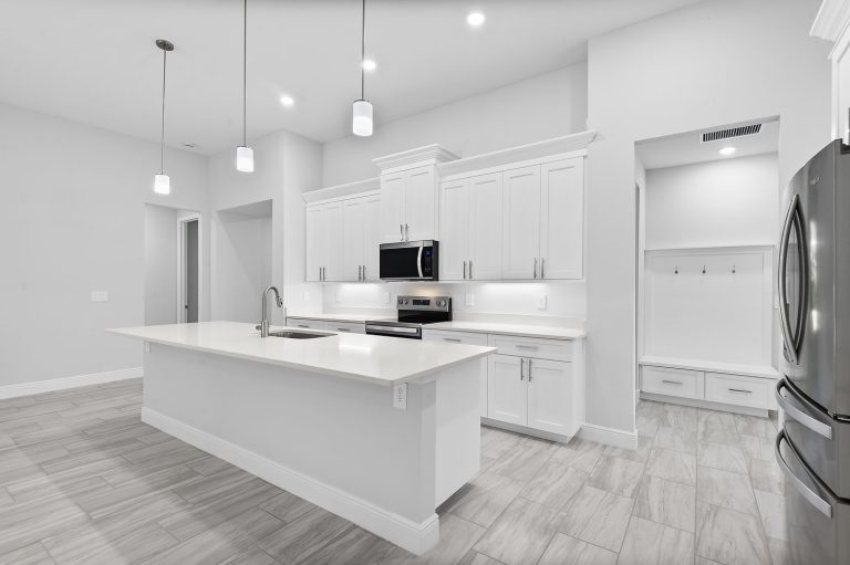 Kitchen with island and pendant lights at 304 North Jungle Road, Geneva