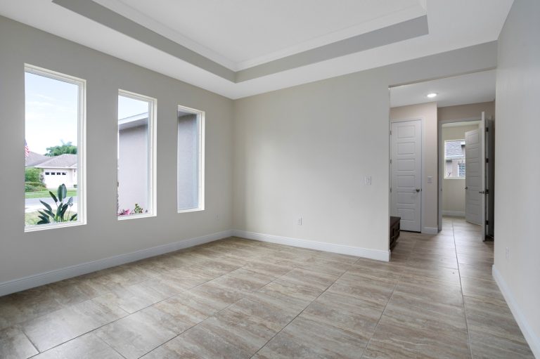 Great room with sliding glass doors at 20478 Netherland Street, Wedgefield