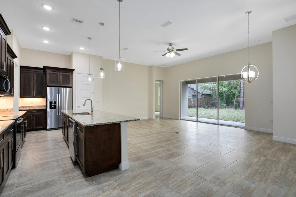 Open kitchen and great room at 20478 Netherland St, Orlando, FL, built by Eastern Homes