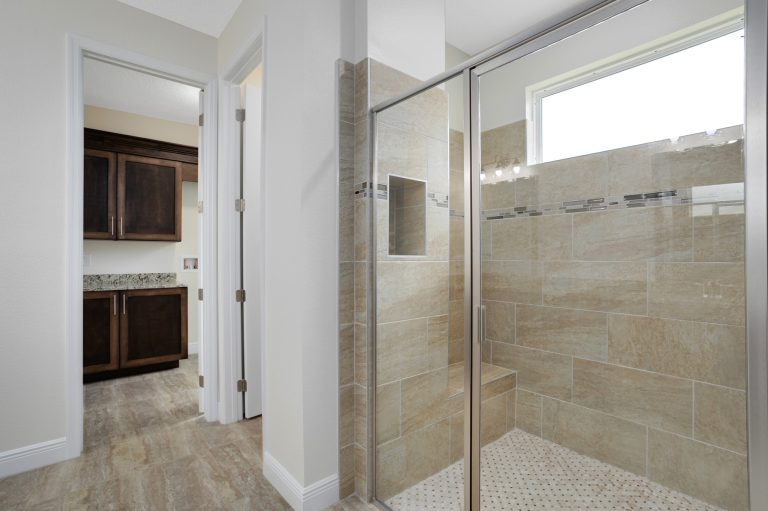 Primary bathroom walk-in shower at 20478 Netherland Street, Wedgefield