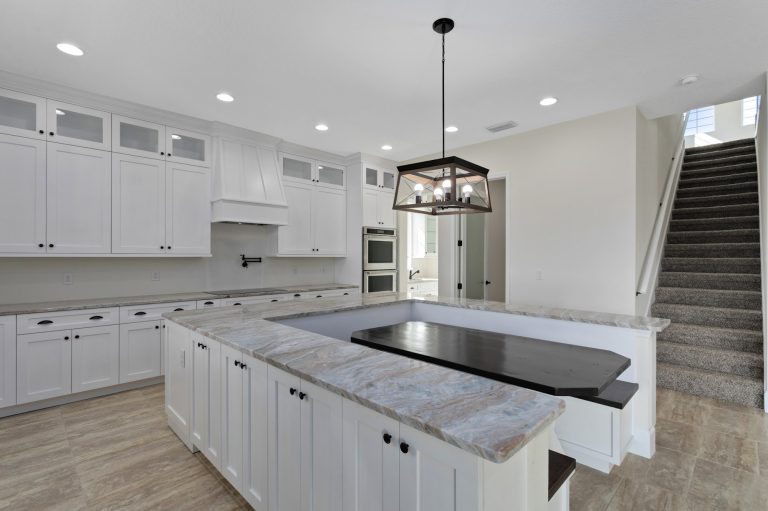 Kitchen and staircase in a new construction home by Eastern Homes at 4001 Ainsley Ave