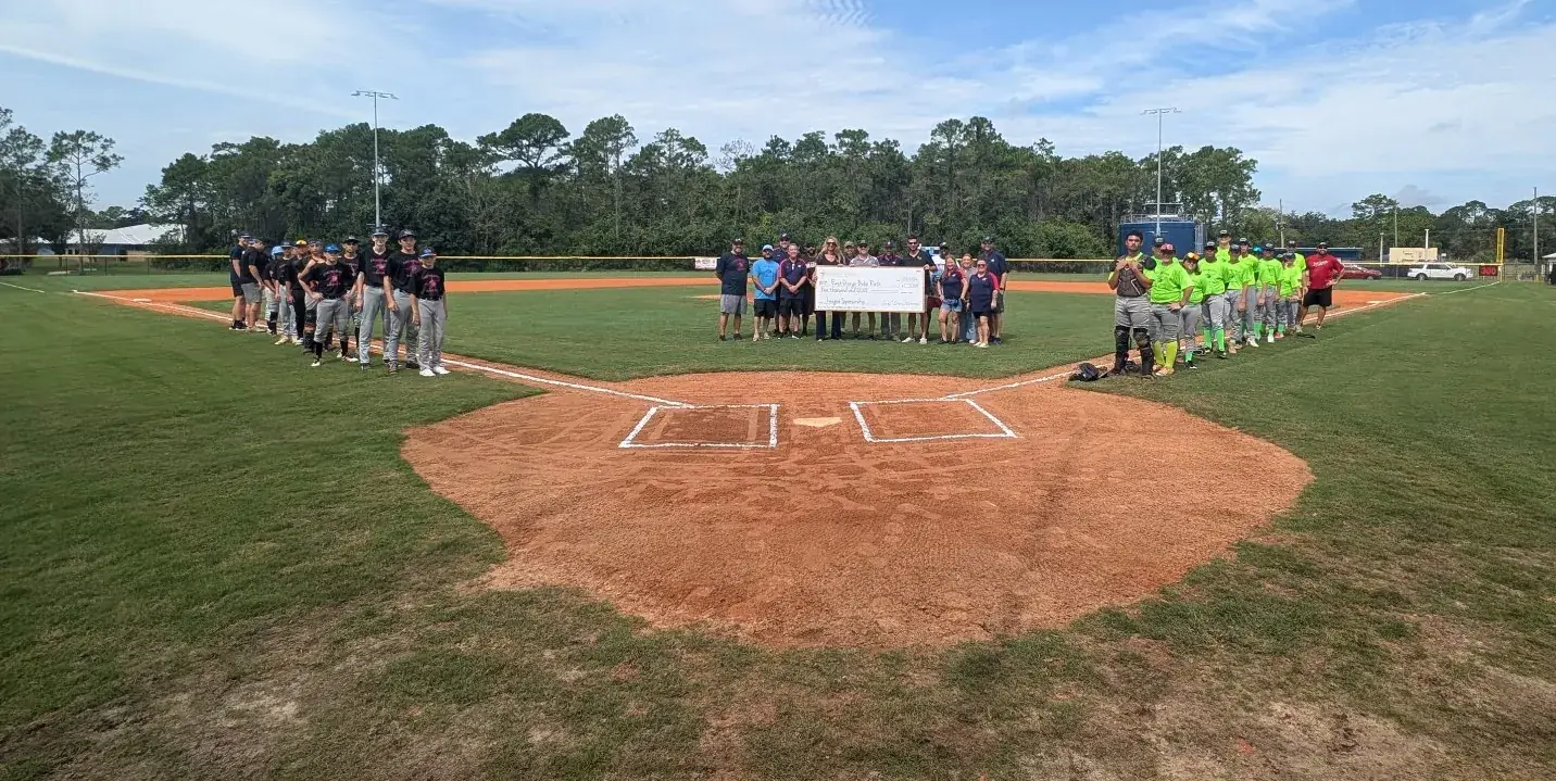 East Orange Babe Ruth teams and the Eastern Homes sponsorship check at home plate on Opening Day